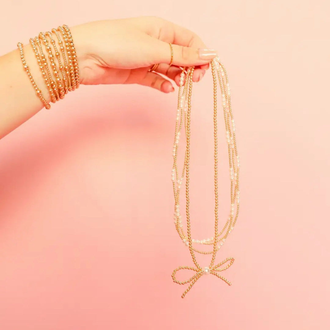 Gold Bow Necklace by Beaded Blondes