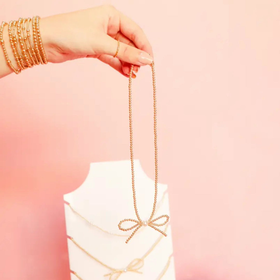 Gold Bow Necklace by Beaded Blondes