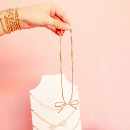 Gold Bow Necklace by Beaded Blondes